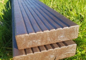 Recycled plastic deck boards with anti-slip surface